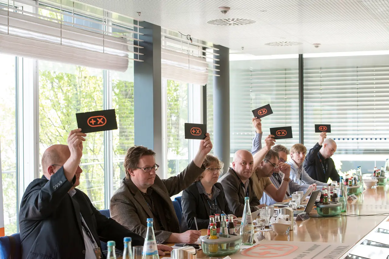 At the long table, every card goes up