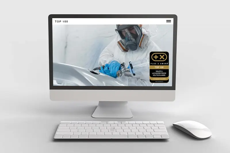 Website mit dem Siegel „Top 100 Maler & Lackierbetriebe“ auf einem Bildschirm
