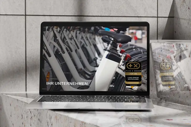 Website mit dem Siegel „Top 100 E-Bike Händler Deutschlands“ auf einem Bildschirm
