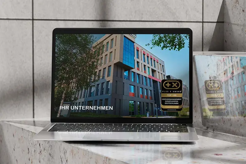 Website mit dem Siegel „Top 100 Gebäudemanagement Dienstleister Deutschlands“ auf einem Bildschirm